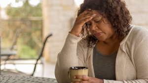 woman looking reflective after binge eating